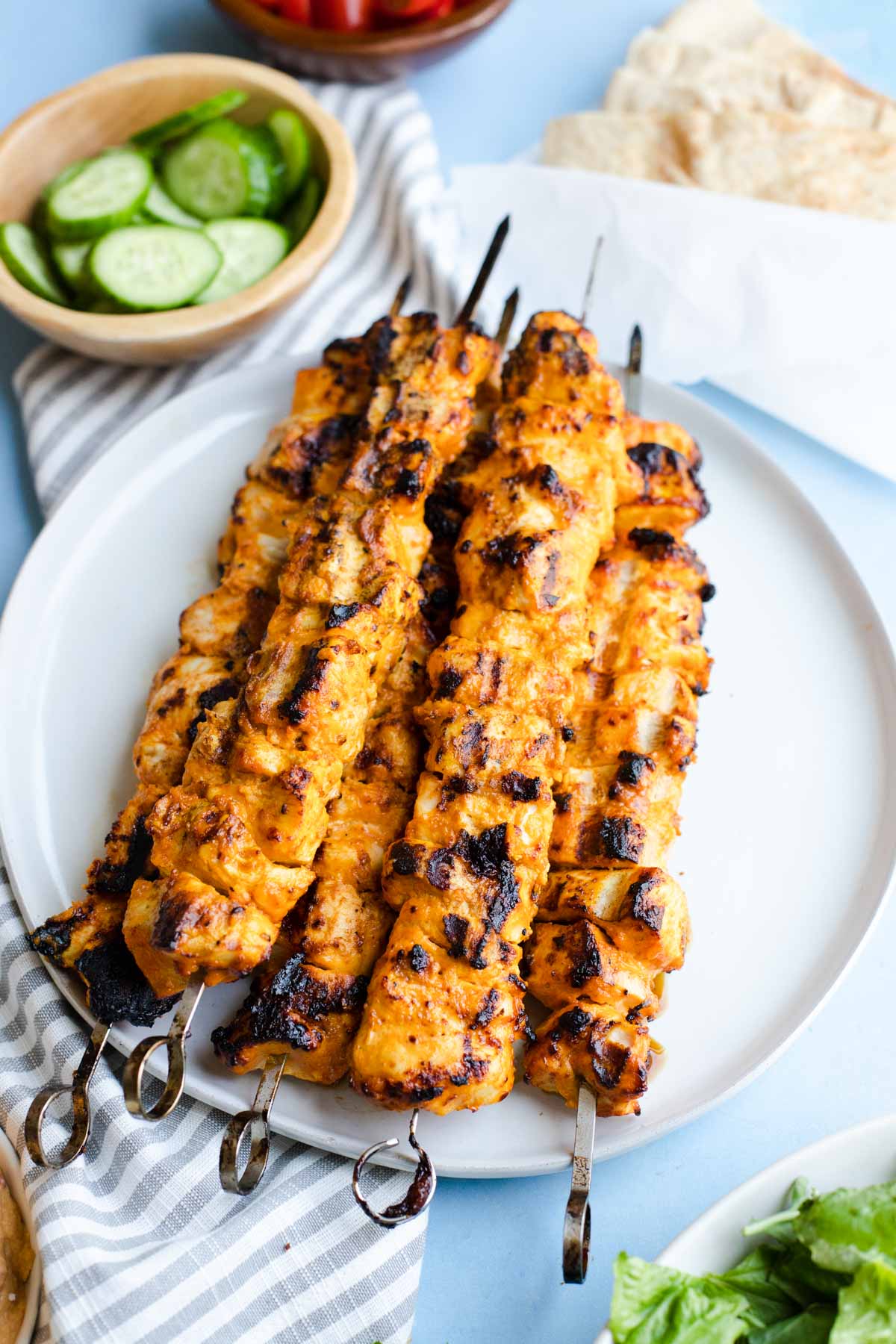 grilled chicken shawarma kebabs on a white plate