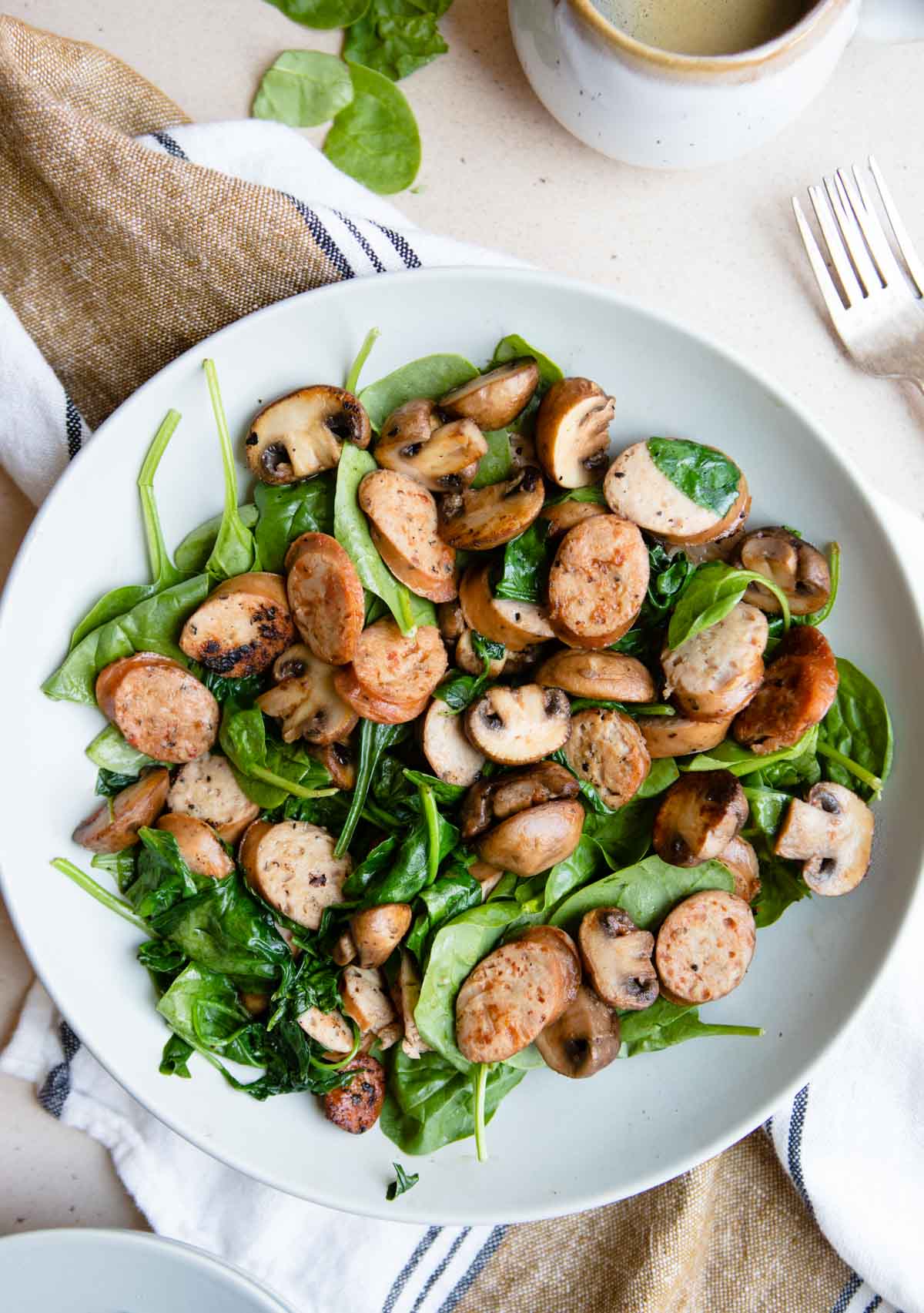 a gray bowl filled with a veggie and mushroom one pan skillet meal