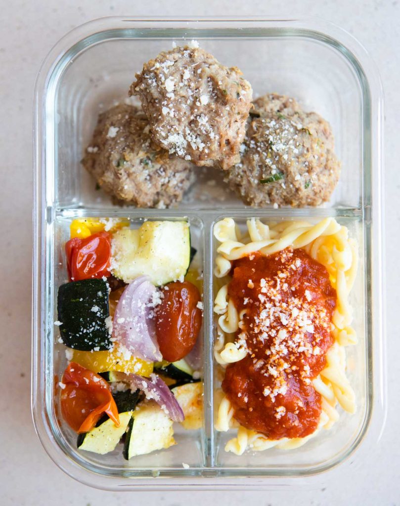 turkey meatballs, protein pasta and roasted veggies in a glass meal prep container