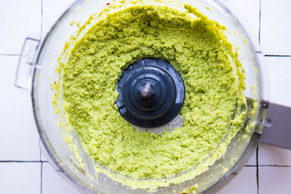 food processor filled with blended up edamame