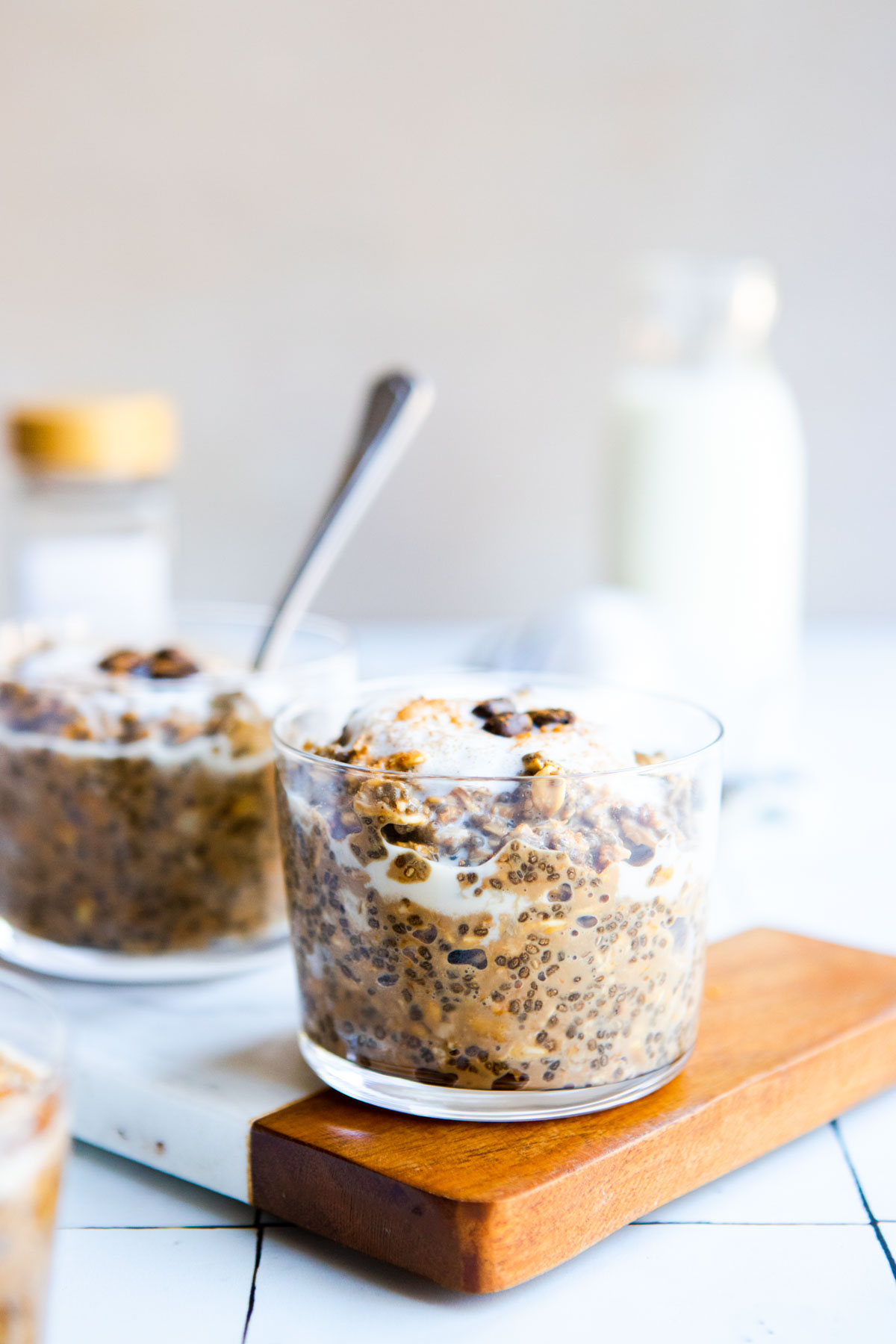 a cup of ready to eat coffee overnight oats garnished with an espresso bean 