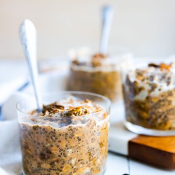 3 small glass jars of coffee overnight oats topped with espresso beans