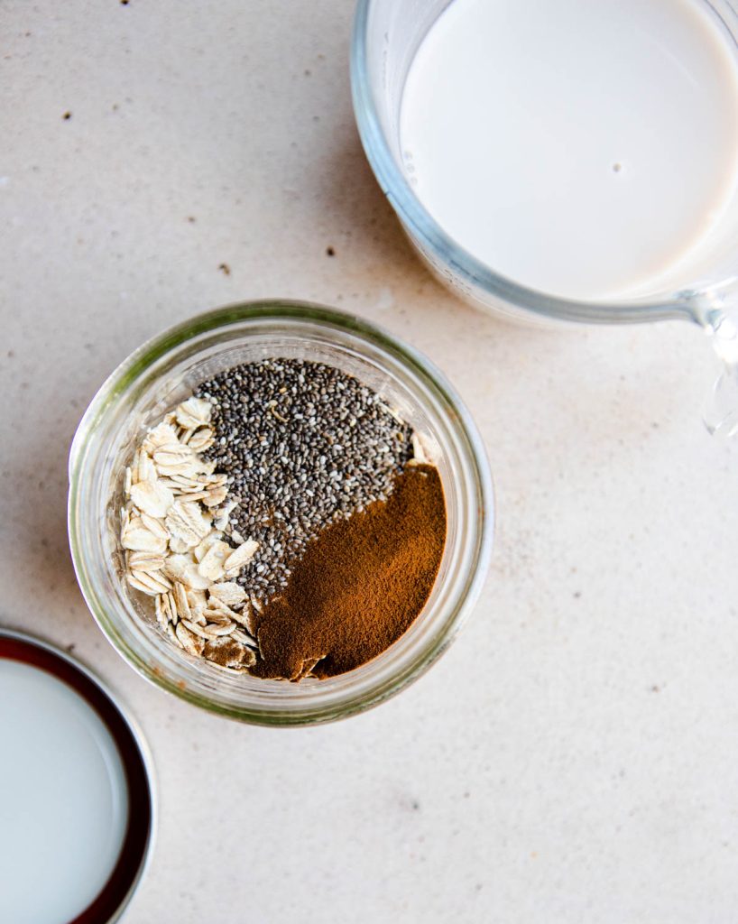 dry rolled oats, chia seeds and espresso powder in a mason jar 