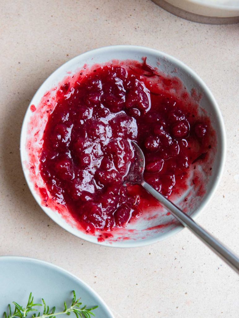 canned cranberry sauce mixed with water in a small bowl