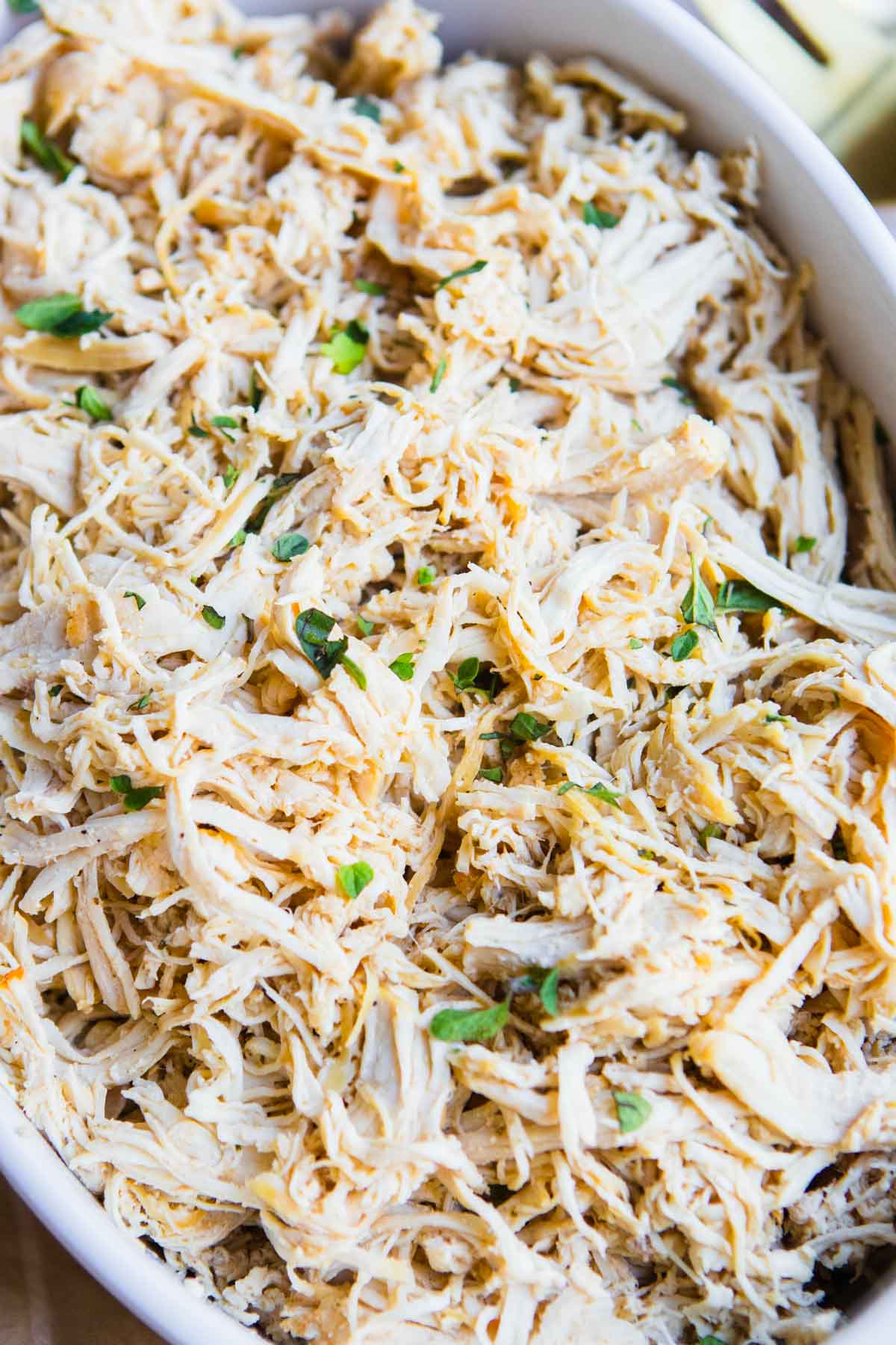 shredded chicken that was made in the Dutch oven served in a ceramic dish