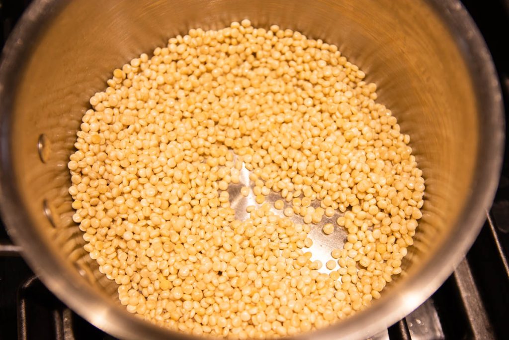 pearl couscous sauteed in a medium saucepan