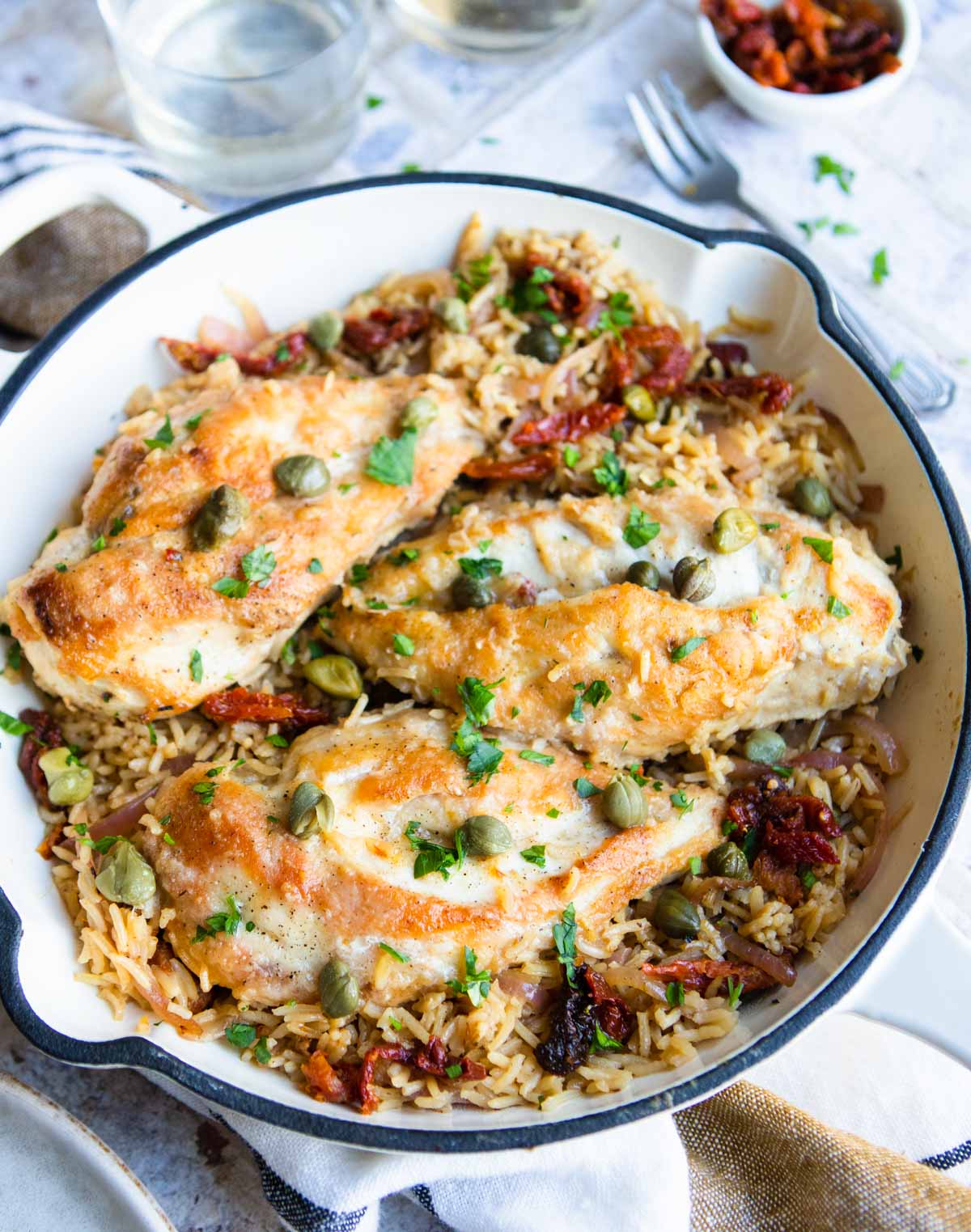 one pan chicken and rice dish with Mediterranean inspired flavors and ingredients 